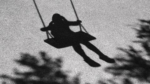 Anonymous child on a swing
