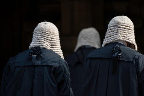 Judges wearing wigs and gowns