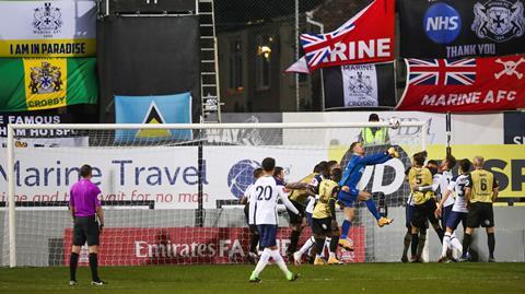 Tottenham's goalkeeper Joe Hart saves on a Marine's attempt to score during the English FA Cup third round soccer match between Marine and Tottenham Hotspur at Rossett Park stadium in Crosby, Liverpool