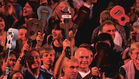 Members of the public performing with the Ukulele Orchestra of Great Britain