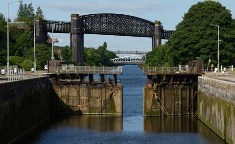 Latchford Locks and the disused Latchford Railway Viaduct crossing the Manchester Ship Canal in Latchford, Warrington