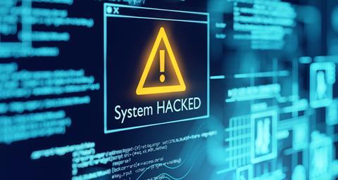 System hacked warning on computer screen