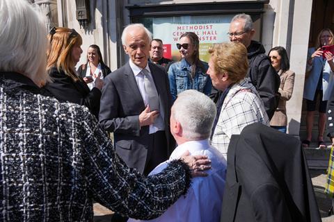 Sir Brian Langstaff with victims and campaigners of the infected blood inquiry