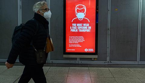 A sign at Westminster underground station warning passengers to wear a face covering