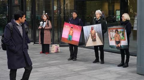 Lawyers and campaigners staged a climate protest outside the London offices of A&O Shearman and Akin