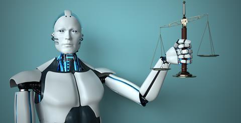 Robot holds justice scales