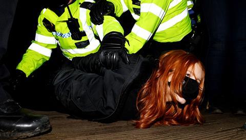 A woman is arrested on the bandstand of Clapham Common, where a vigil was taking place for Sarah Everard