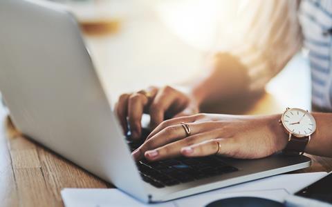 Woman typing on laptop