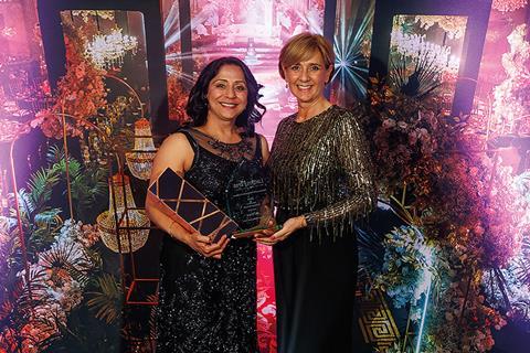 Jas Thiara receives the excellence in professional services award from Tracy Evans of Alsters Kelley
