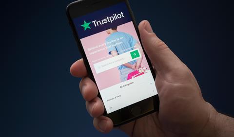 The Trustpilot homepage is displayed on a phone