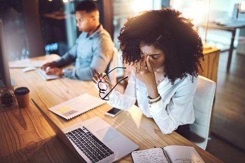 Woman stressed at office desk