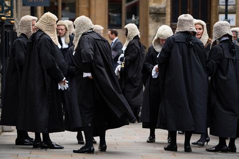 Judges wearing robes and wigs