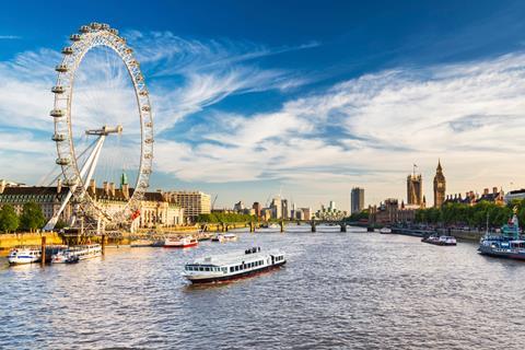 Shot of the Thames River, London, showing the London Eye and the Houses of Parliament