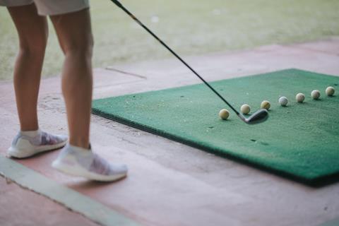 Anonymous golfer at driving range