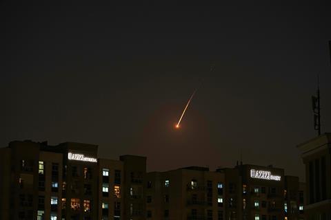 The flare of a projectile is seen over the skyline of Dubai, United Arab Emirates, February, 2026