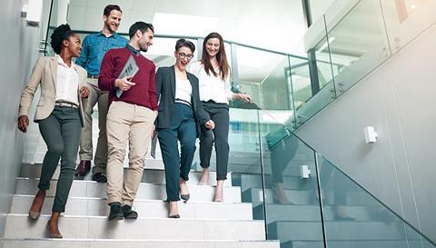 Office workers walk together