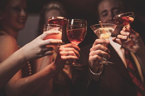 A group of collegues raise their glasses