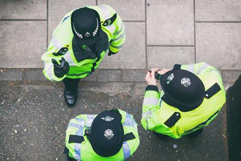 Three police officers talking on duty