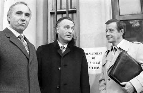 Sir Humphrey Appleby, as played by Nigel Hawthorne, Jim Hacker, as played by Paul Eddington, and Bernard Woolley, played by Derek Fowlds