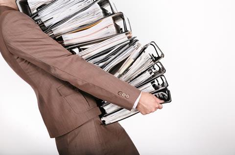 Businesswoman carrying files