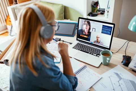 Woman talking to colleagues on video call