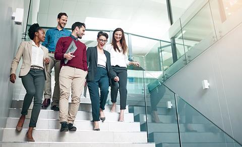 Office workers walk together