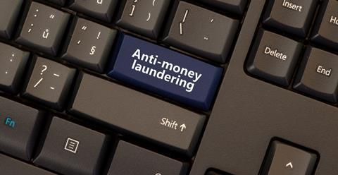 Anti-money laundering button on computer keyboard