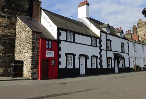 It’s hard to miss the bright red facade sitting amongst the quayside cottages in Conwy
