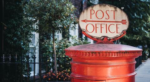Post Office sign on top of a letterbox