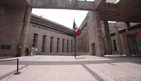 A Mexican flag stands amid the empty corridors of the federal court during a worker's strike over reforms that would make all judges stand for election in Mexico City, August 2024