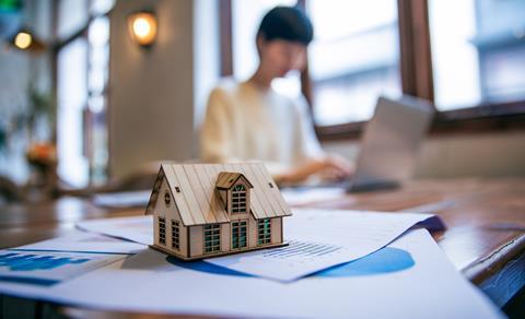 Housing solicitor works on a laptop