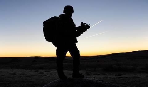 The silhouette of a British soldier on patrol