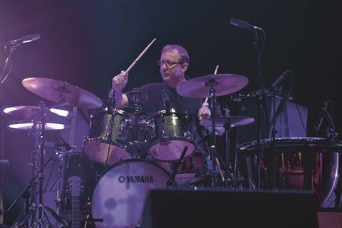 Dave Rowntree of Kingsley Napley on drums with Blur
