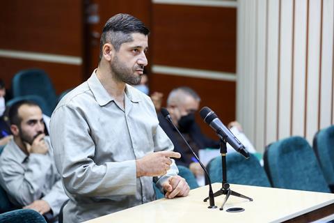 Mohammad Hosseini speaks during his trial