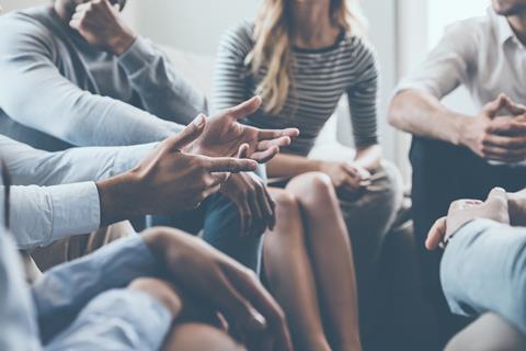 Colleagues talking in a group