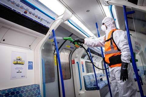 A Victoria line train is sprayed with an antiviral coating at Northumberland Park depot during the COVID-19 outbreak