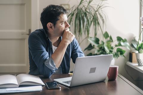 Man working on laptop at home