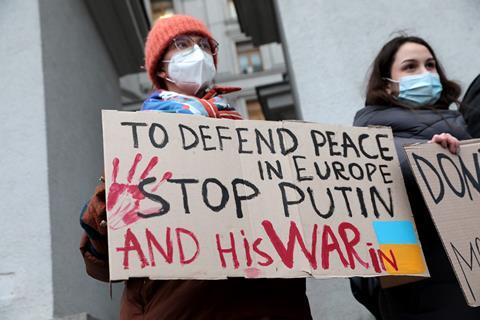 Participants hold placards during the Turn ON sanctions! demonstration to call for action against Russian aggression outside the Ministry of Foreign Affairs, Kyiv, capital of Ukraine