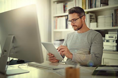 Man working on tablet at desk