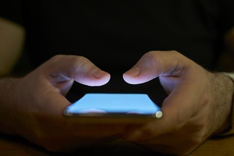 A man holds a phone in his hands