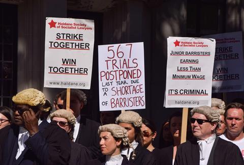 Criminal barristers gathered outside the Supreme Court as the strikes over pay and legal aid fees entered their third week