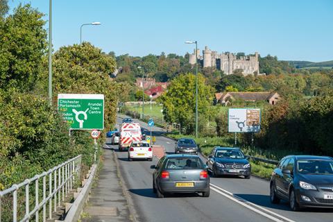 Vehicles travelling along the Arundel bypass, the A27 road, near to Arundel Castle in Arundel, West Sussex