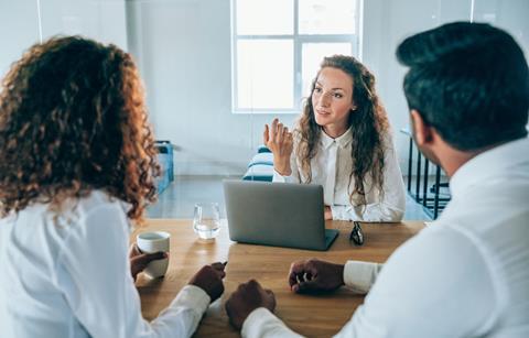 Solicitor talks with her clients