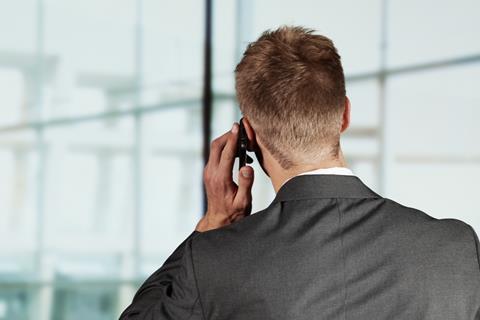 An anonymous businessman talks on the phone