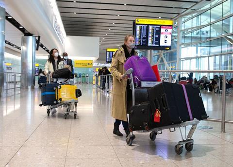 Passengers arriving at Heathrow Terminal 2 during Covid