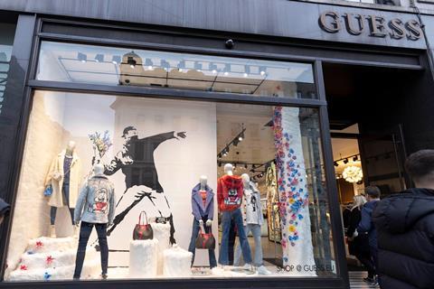Banksy art in the window of Guess, Regent St