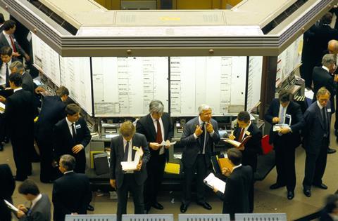 Brokers on the old trading floor of the London Stock Exchange, a few days before its replacement by the Stock Exchange Automated Quotation system, October 1986