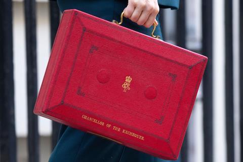 A close up shot of Chancellor of the Exchequer Rachel Reeves holding the red briefcase