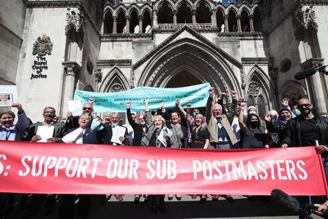 Former post office workers celebrate outside the RCJ after their convictions were overturned by the Court of Appeal