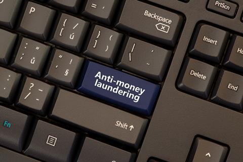 Anti-money laundering button on computer keyboard
